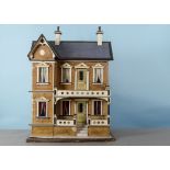 A Gottschalk blue-roofed dolls’ house, with brick papered façade, cream, blue and gold painted
