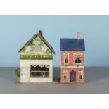 A vintage dolls’ house ‘A Crust Baker and Confectioner’, a single roomed shop with painted front