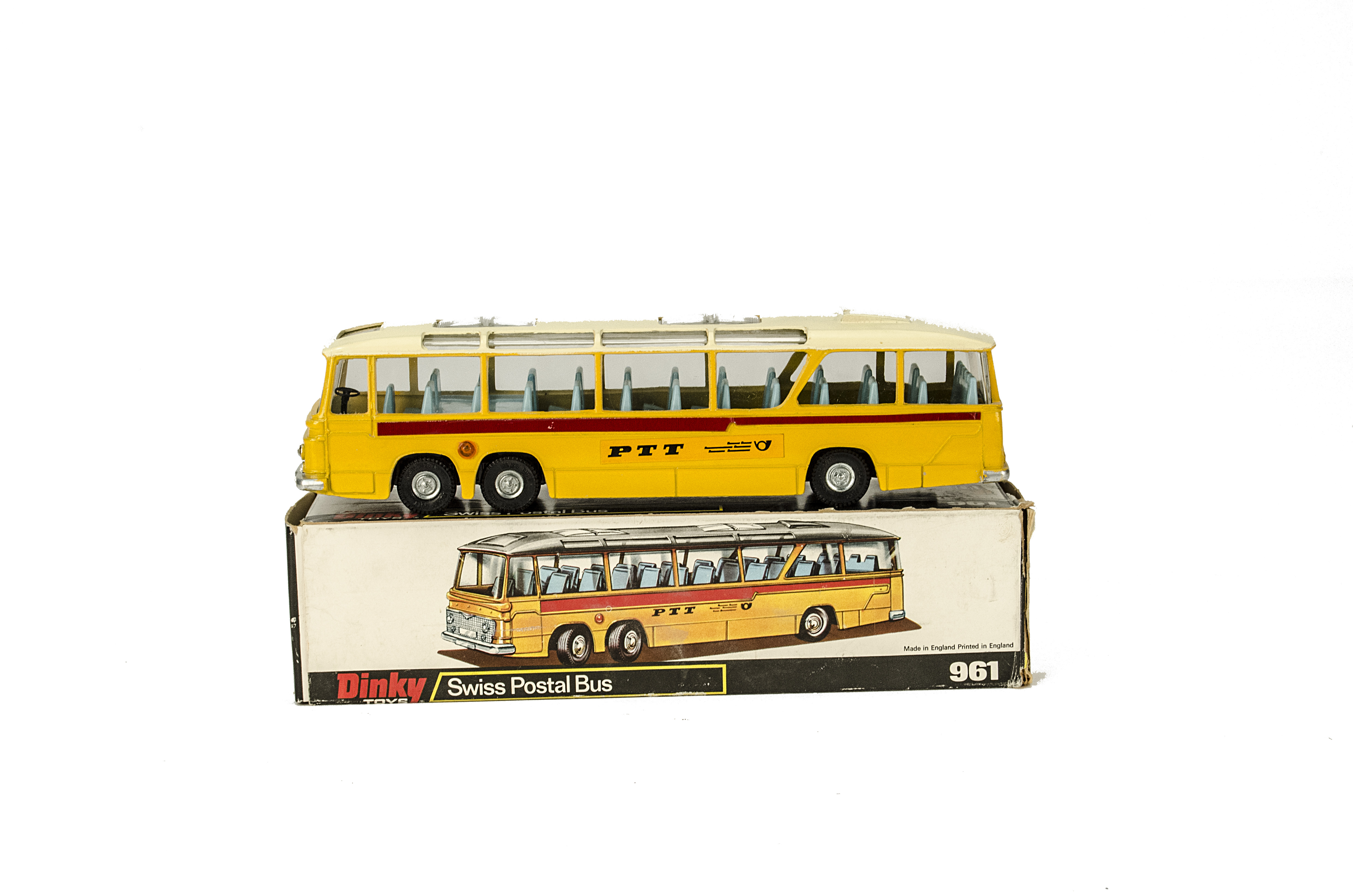 A Dinky Toys 961 Swiss Postal Bus, yellow body, cream roof, blue interior, PTT emblem, in original