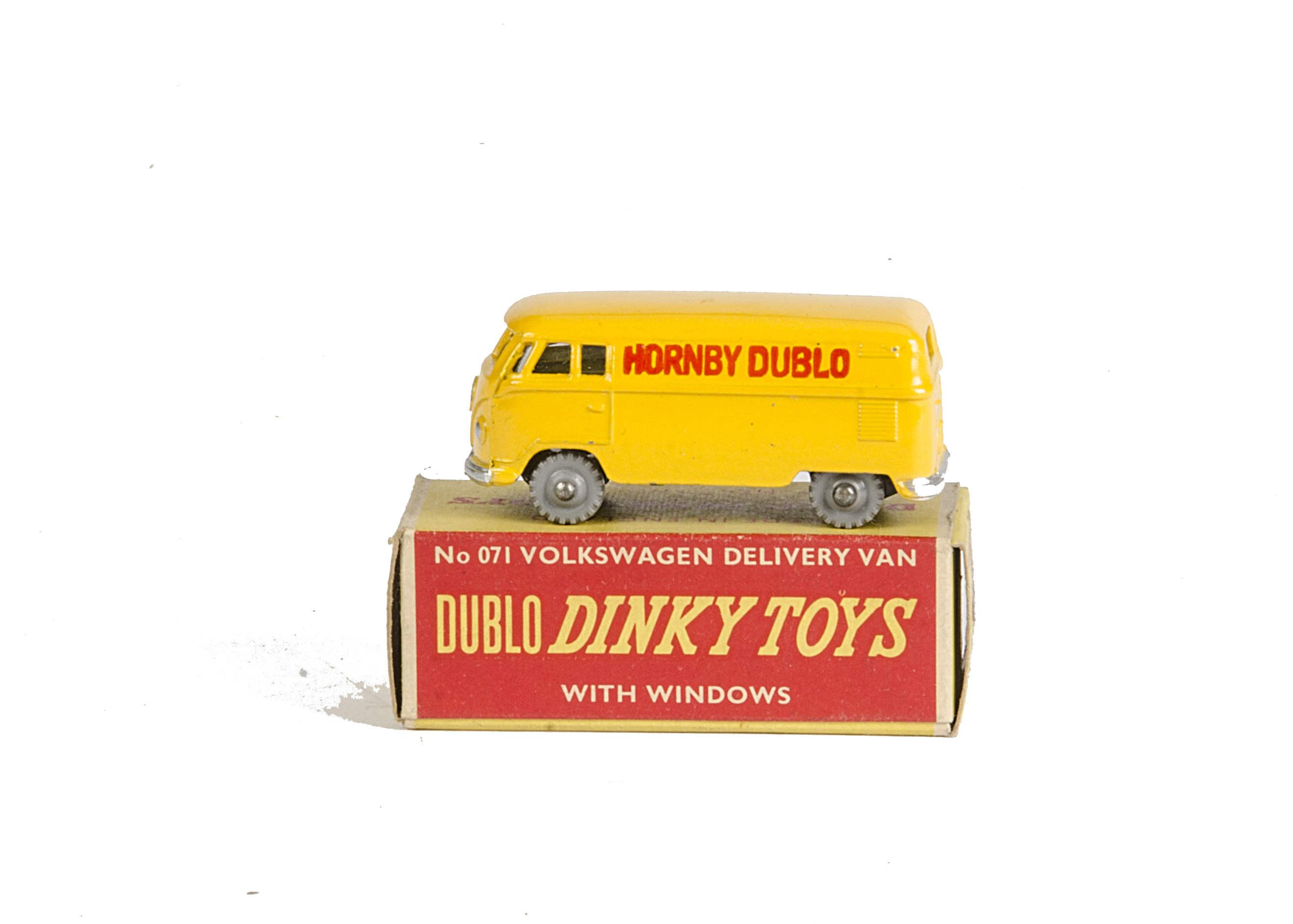 A Dublo Dinky Toys 071 Volkswagen Delivery Van, yellow body with red logo, grey knobbly wheels, in