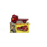 A Dinky Toys 425 Bedford TK Coal Lorry, red body, blue interior, red plastic hubs, five bags,