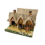 Unmarked wooden model of a Coaching Inn with courtyard in the post WW2 Britains style and scale,