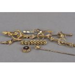 Seven 19th century and later gold and other brooches, one a spider and seed pearl bar brooch, one