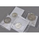 Four interesting coins, including a Charles II quarter dollar, F, a George IV 1826 shilling, EF, a