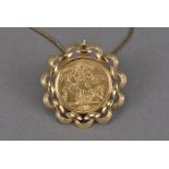 A George V full sovereign in pendant, the 9ct gold circular pierced mount supporting a 1912 gold