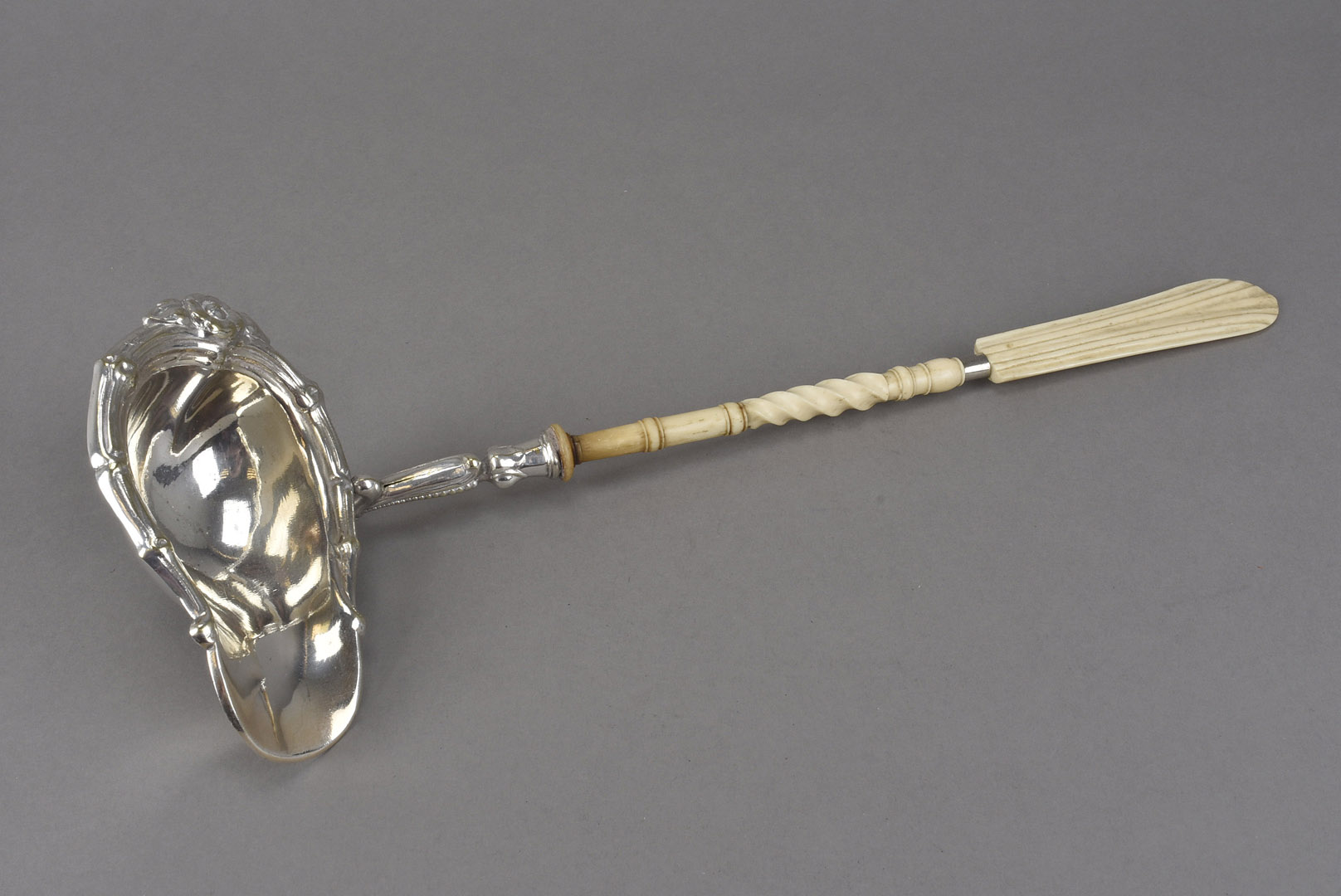 A Victorian period or earlier silver plated toddle ladle, having carved and worked bone handle, AF