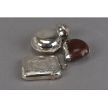 An Edwardian silver mounted seed pod vesta case, together with a similar period silver vesta case
