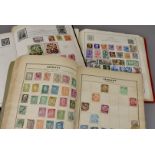 A collection of stamps, with a good selection of older world stamps, including a Strand album, two