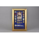 A highly desirable Victorian coin and medal montage, gilt frame with blue baize, mounted with four