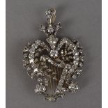 A fine late Victorian diamond pendant cum brooch, the silver and gold frame having central harp