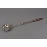 A Georgian period silver toddy ladle, oval bowl with feathered rim, initials to underside, repaired,