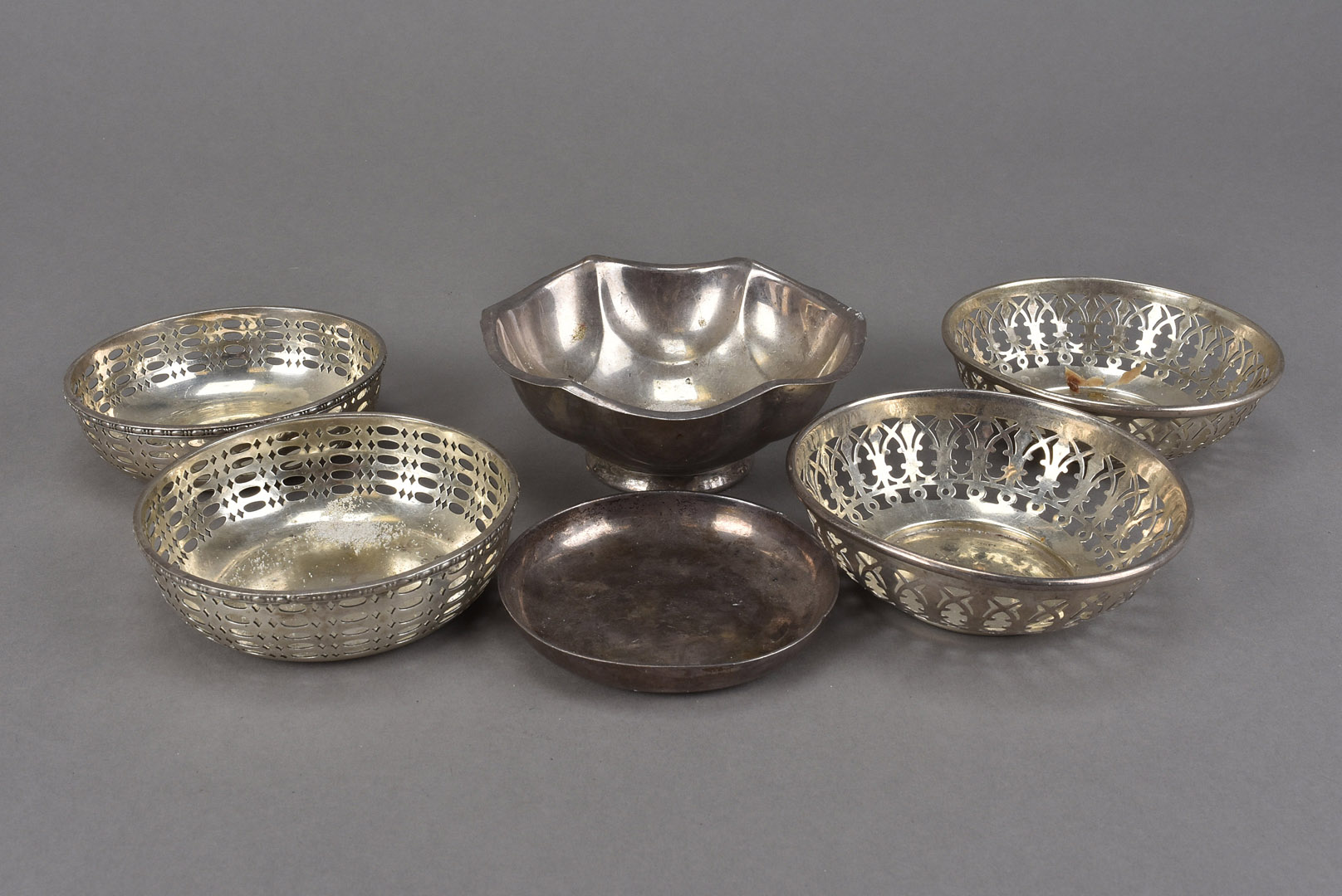 A group of six Victorian and later silver dishes, including a pair of pierced examples by Goldsmiths