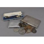 A collection of coins and silver, including an Art Deco silver cigarette case, 6.5 ozt, a plated