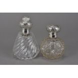 A Victorian cut glass and silver mounted perfume bottle, together with an Edwardian hob nail cut