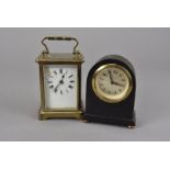 An Edwardian brass carriage timepiece, in travel case, in need of attention, enamel dial cracked,