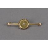 A Victorian 9ct gold and diamond brooch, circular panel set with an old cut on pin bar, 4.7g