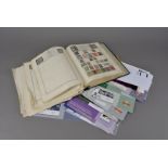 A large collection of stamps and related items, in two boxes, including several albums and