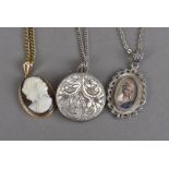 Three vintage pendants on chain, including a continental white gold portrait on silver chain, a