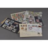 A collection of World stamps, the mixed material housed in a number of small albums and stock book