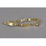 An 18ct gold marked line bracelet, with flat links, one damaged, marked 750, 15.2g