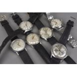 A group of six vintage stainless steel gentlemen's wristwatches, including a Marconi, a Timex