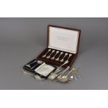 A set of six modern silver Sovereign Queen spoons, in case, together with a silver cased feeding set