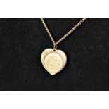 A modern half sovereign in 9ct gold pendant mount, the 2000 dated coin in heart shaped mount, on a