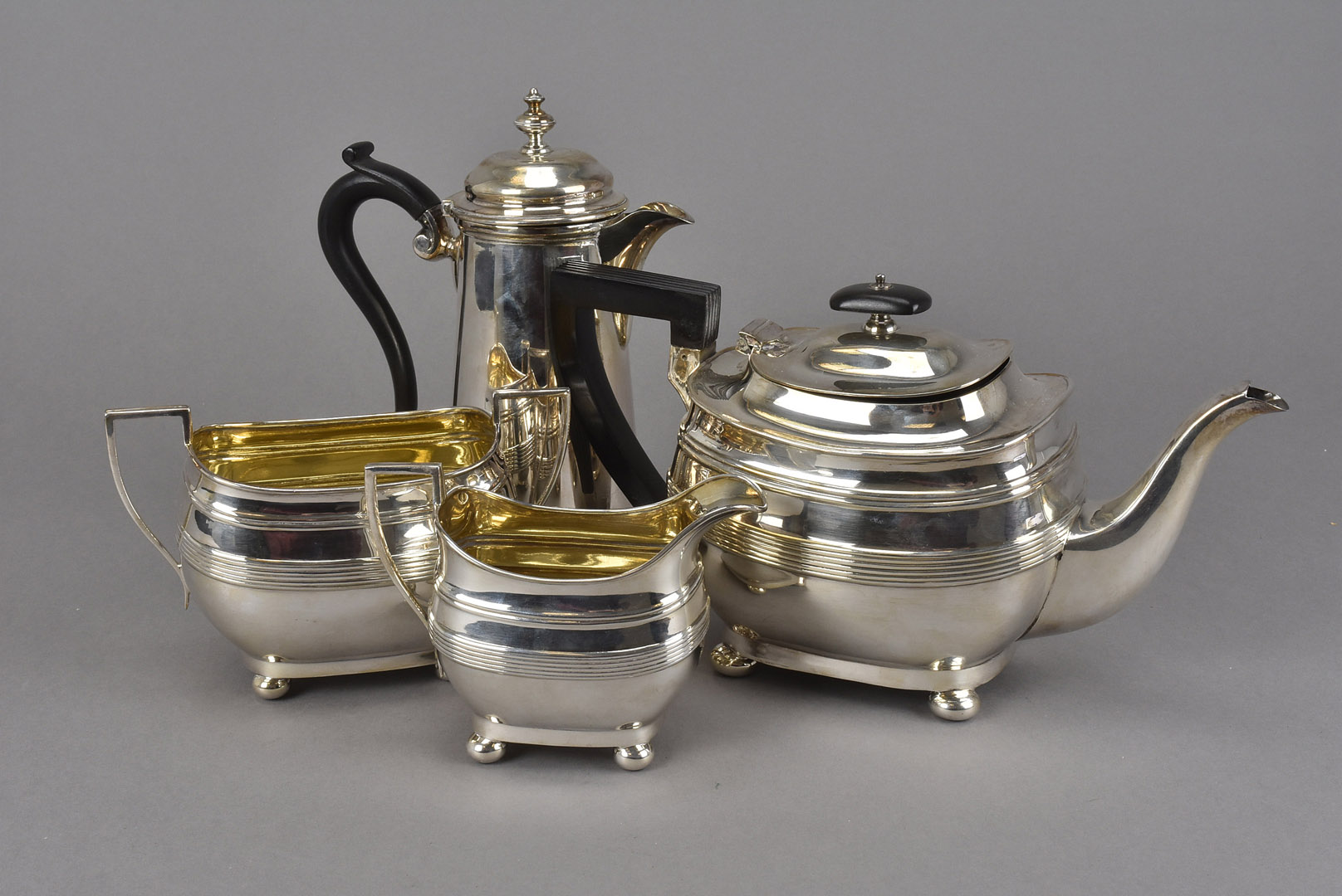 A George V Wedgwood Jasperware and silver mounted four piece tea set, together with a three piece