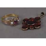 A 19th century gold and garnet pendant, foil backed red stones, together with a small gold, amethyst