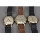 Three vintage 9ct gold gentleman's wristwatches, each manual wind, including a J.W. Benson, a