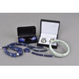 A small group of modern jewellery, including a pair of globe cufflinks, a pair of lapis lazuli