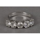 A modern five stone diamond engagement ring, the 18ct white gold mount set with brilliant cuts