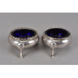 A pair of Victorian silver cauldron salts by WKR, with blue glass liners (4)