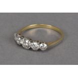 An Art Deco period five stone diamond engagement ring, graduating transitional brilliant cuts in