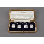 A set of four Art Deco period dress studs, the 9ct white gold mounts with mother of pearl and seed