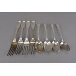 A set of four George IV silver forks by William Eaton, fiddle pattern with family crest to terminal,