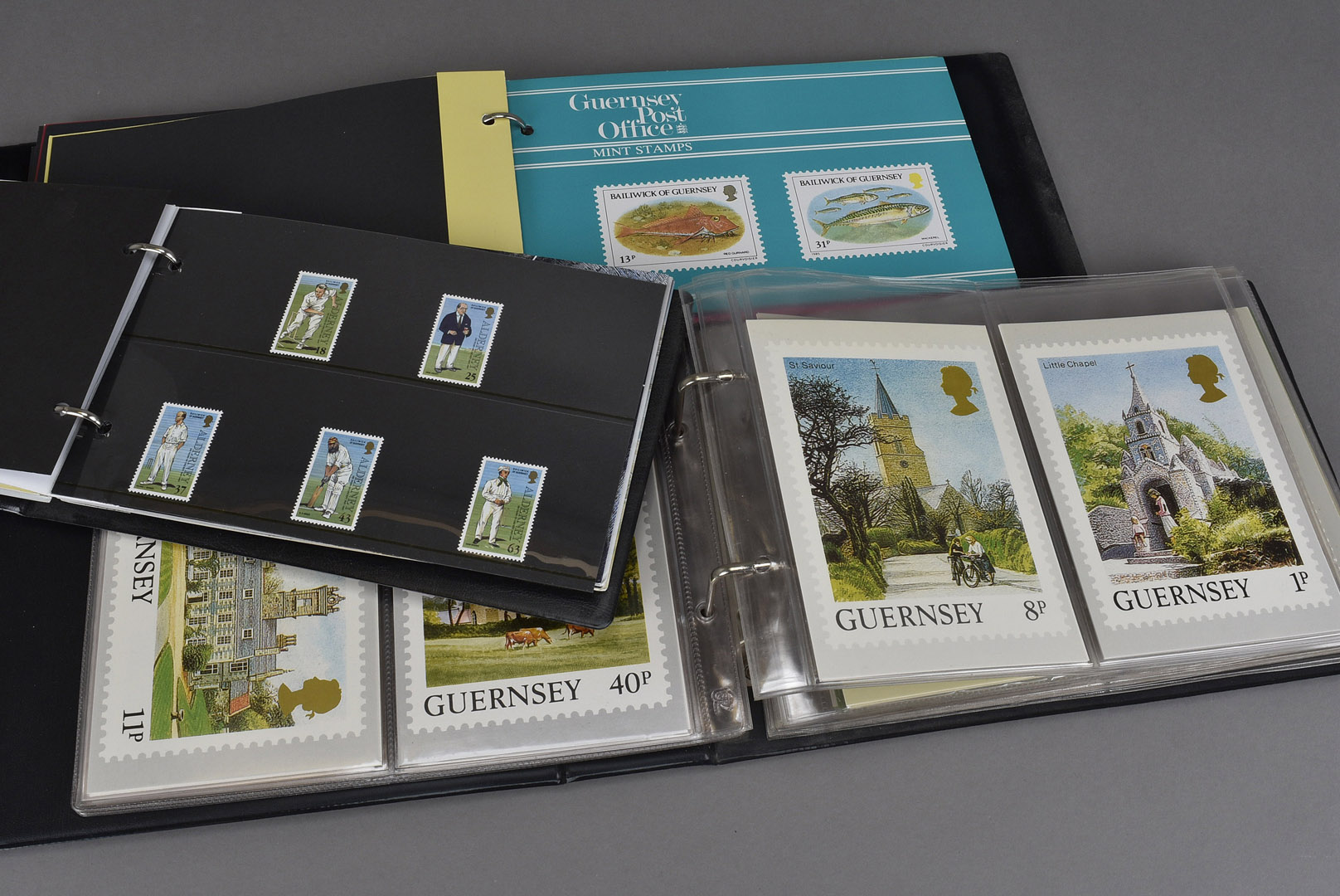 A collection of thirteen albums of modern presentation stamp sets, from Jersey, Guernsey and Isle of