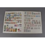 A diverse collection of British and Commonwealth stamps, presented in albums, stockbooks, and some