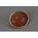A fine and rare archaeological revival carnelian bead and gold brooch by Castellani, as appeared