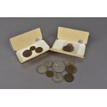 A collection of George V reign coins, presented in cigar tins with years dates from 1911 through