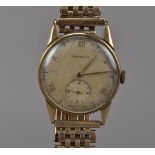 A 1940s 9ct gold Longines gentleman's wristwatch, circular case, dial somewhat pitted, movement