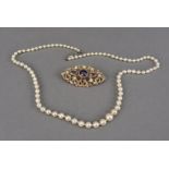 A modern 9ct gold amethyst and pearl brooch and pearl necklace, the traditional pierced brooch