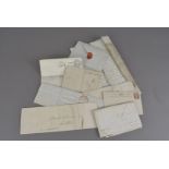 Ten items of postal history, to include pre-stamp entries, embossed covers and postal cards
