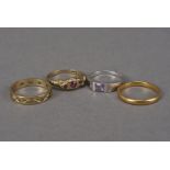 Four gold ladies rings, including a 22ct gold wedding band, 2.4g, a 9ct gold three stone ruby, an