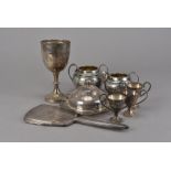 A collection of silver and silver plated items, including a 1940s silver trophy goblet, three Art