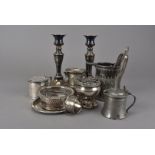 A pair of Victorian Sheffield plated candlesticks, together with a silver plated mustard, a pewter