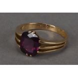 A late Victorian gold and amethyst signet ring, with later date to inner, having a cushion cut
