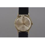 A 1970s 9ct gold Rolex gentleman's wristwatch, satin gilt dial with batons, appears to run, some