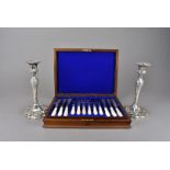 A Victorian silver plated and mother of pearl handled set of twelve fish eaters, presented in a