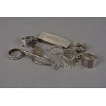 A small group of silver and white metal jewellery and other items, including six rings, a money